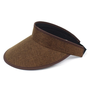 Detail view of woven hemp sun visor with brown fabric trim and adjustable elastic strap