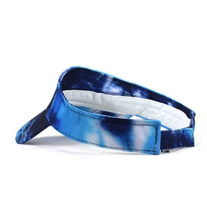 Detail view of the adjustable velcro closure and blue tie-dye pattern on the sun visor hat