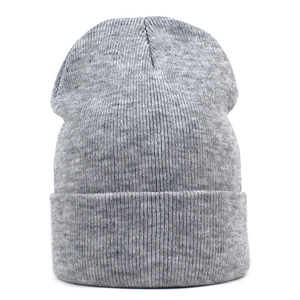 Close-up of fine knit texture and cuffed design on dark grey winter beanie hat
