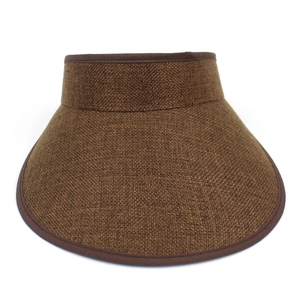 Close-up of the woven straw texture and reinforced dark brown fabric edge of the sun visor