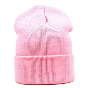 Detailed view of the fine ribbed knit texture and fold-over cuff on the pink winter beanie
