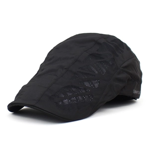 Close-up of breathable mesh panels and brand logo on a black men's flat cap