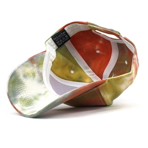 Internal view of colorful tie-dye cotton baseball cap with breathable vents and labels