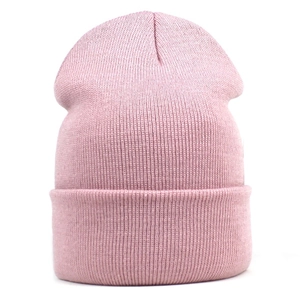 Close-up of pink rib-knit beanie showing texture and thick folded cuff details