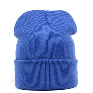 Detailed close-up showing the royal blue knitted texture and cuffed design of the beanie