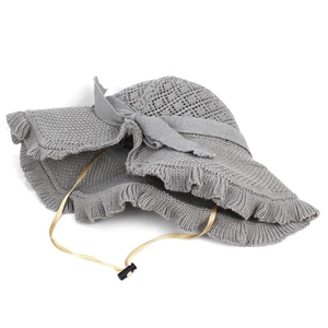 Grey knitted sun hat for women with bow decoration and adjustable windproof strap
