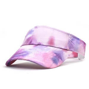 Detail of purple and pink tie-dye pattern on adjustable sun visor hat for women