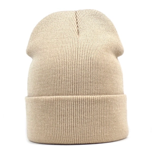 Detail of beige ribbed knit beanie showing high-quality vertical texture and folded cuff