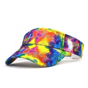 Close-up detail of tie-dye sun visor with reinforced stitching and thick canvas texture