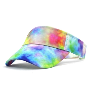 Detailed side view of tie-dye visor hat with multi-color gradient and reinforced stitching