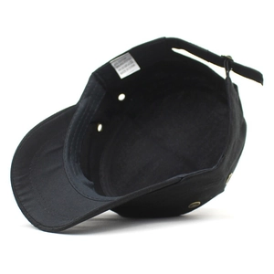 Detailed macro view of the black cotton army cap interior showing the size label and sewing