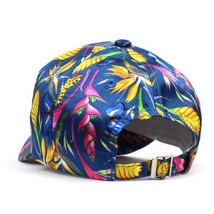 Deep blue baseball cap with tropical flower and butterfly print featuring silver buckle