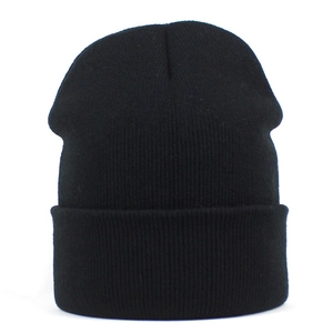 Close-up of black ribbed knit beanie showing high-quality elastic fabric texture