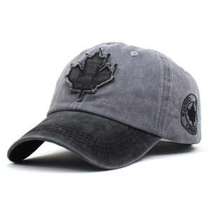 Detail showing retro washed canvas baseball cap with embroidered maple leaf and Canada text