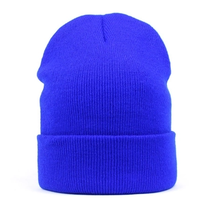 Close-up of bright blue ribbed knit beanie featuring a classic fold-over cuff design