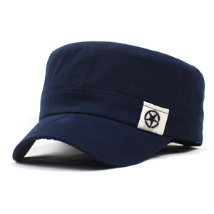 Detail of navy blue cotton cadet cap featuring a star patch and twill fabric texture