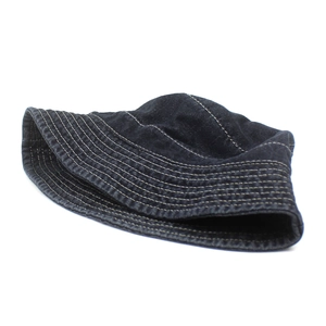 Deep blue denim bucket hat with white contrast stitching and minimalist summer sun protection