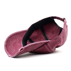 Distressed burgundy washed cotton baseball cap with torn details and adjustable metal buckle