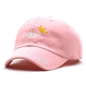 Close-up of pink baby baseball cap featuring crown embroidery and bebe text details