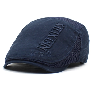 Detail of navy blue mesh beret cap with breathable fabric and side letter embroidery