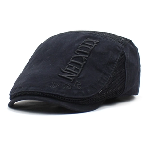 Detail shot of breathable mesh panel and gothic embroidery on black beret cap