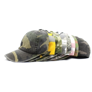 Detailed side view of stacked cotton camouflage baseball caps in various colors and patterns