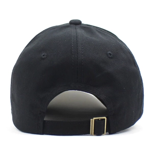 Rear view of black cotton baseball cap showing adjustable bronze metal buckle strap