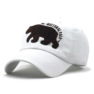 White cotton baseball cap with embroidered Yellowstone National Park bear logo on the front