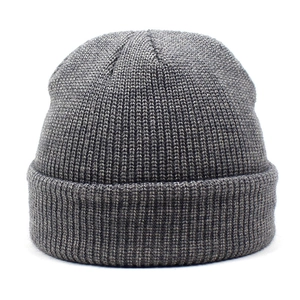 Detailed view of the dark grey ribbed knit texture and wide folded cuff on this beanie
