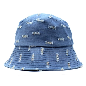 Distressed dark blue denim bucket hat with ripped details and reinforced stitched brim
