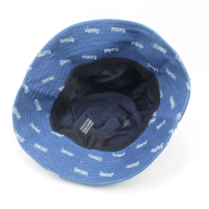 Deep blue denim bucket hat with distressed rectangular fringe details and flat top crown