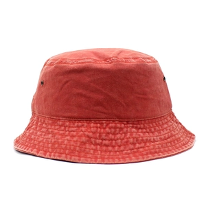 Detail view of cotton bucket hat with stitching lines and metal ventilation eyelets