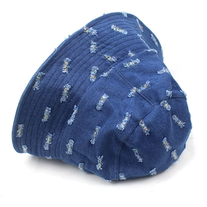 Unisex blue denim bucket hat with stylish distressed holes and colorful thread accents