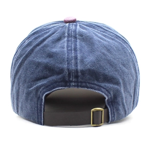 Close-up of vintage denim baseball cap back with brown leather strap and metal buckle