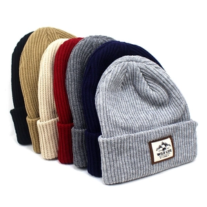 Winter striped knit beanies in seven colors with leather patch for outdoor warmth