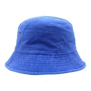 Detailed view of royal blue cotton bucket hat with side eyelets and reinforced brim stitching