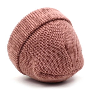 Unisex winter knit beanie in dusty rose with a classic ribbed texture and folded cuff design
