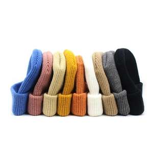 Multiple colors of ribbed knit beanies for men and women showing various winter hat options