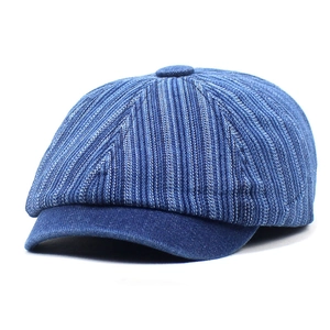 Vintage denim newsboy cap featuring blue striped texture and curved brim for women
