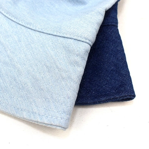 Women's foldable denim sun hat in light and dark blue with wide brim and stitched texture