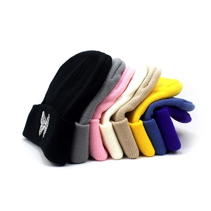 Women's warm winter knit beanie with butterfly embroidery available in multiple vibrant colors
