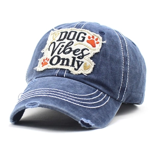 Detail of navy washed cotton baseball cap with DOG Vibes Only embroidery and distressed holes