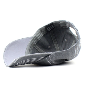 Vintage washed cotton baseball cap with distressed brim and breathable metal eyelets
