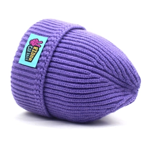 Purple cable knit beanie for women with fold-over cuff and graphic rider woven label