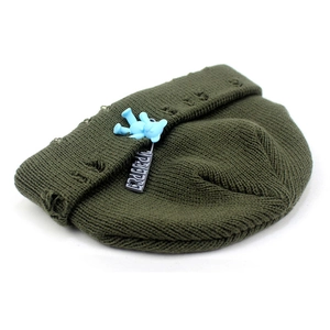 Deep olive green knit beanie with distressed holes and a cute 3D blue bear pendant