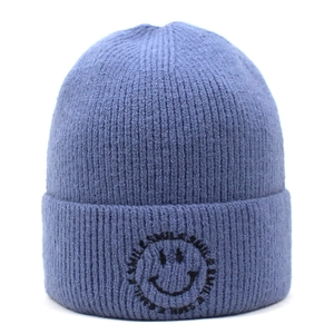 Close-up of the detailed vertical ribbed knit texture and smile embroidery on beanie