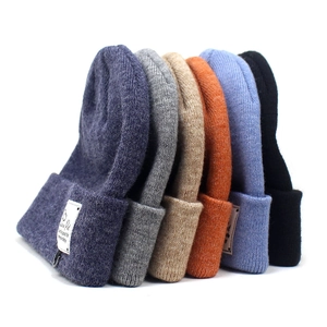 Knit cashmere beanie hats for women in multiple colors with stylish stitched woven labels