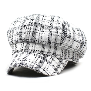 Retro black and white plaid newsboy cap with classic British style and curved brim