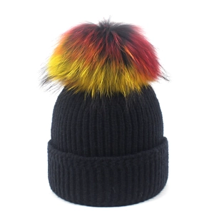 Black ribbed knit beanie for women with large colorful gradient raccoon fur pom-pom