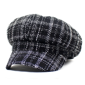 Vintage black and white plaid newsboy hat for women with a classic tweed texture finish